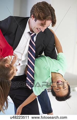 Children Greeting Father On Return From Work View Large Photo Image Stock Image - Children Greeting Father On Return From Work. Fotosearch
