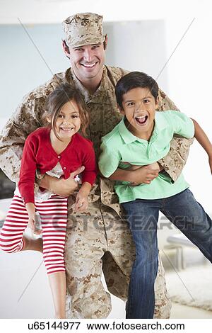 Stock Photo - Children Greeting Military Father Home On Leave. Fotosearch