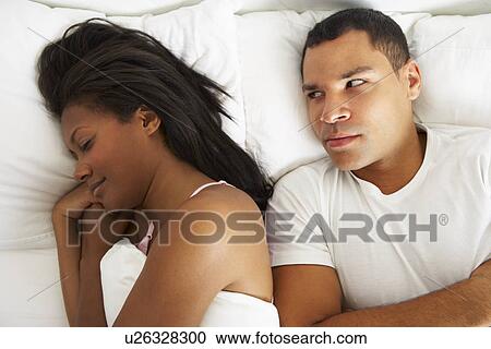 Couple In Bed With Relationship Difficulties View Large Photo Image Stock Image - Couple In Bed With Relationship Difficulties. Fotosearch
