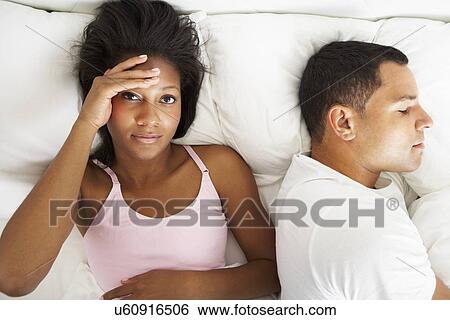 Couple In Bed With Relationship Difficulties View Large Photo Image Stock Photograph - Couple In Bed With Relationship Difficulties. Fotosearch