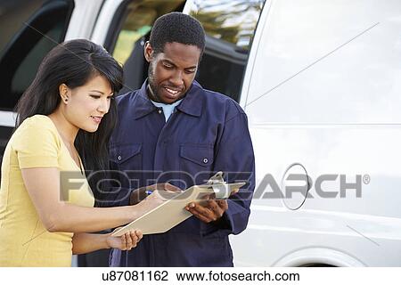 Customer Signing For Delivery From Courier View Large Photo Image Stock Image - Customer Signing For Delivery From Courier. Fotosearch