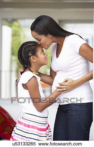 Daughter Hugging Pregnant Mother View Large Photo Image Stock Photography - Daughter Hugging Pregnant Mother. Fotosearch