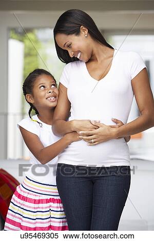 Daughter Hugging Pregnant Mother View Large Photo Image Stock Photography - Daughter Hugging Pregnant Mother. Fotosearch
