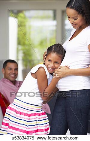 Daughter Listening To Pregnant Mother's Stomach View Large Photo Image Stock Photography - Daughter Listening To Pregnant Mother's Stomach. Fotosearch