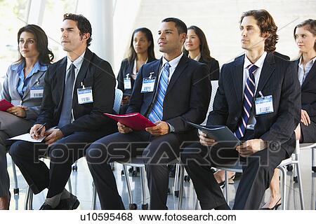 Delegates Listening To Speaker At Conference View Large Photo Image Stock Photo - Delegates Listening To Speaker At Conference. Fotosearch