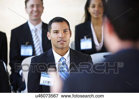 Delegates Listening To Speaker At Conference View Large Photo Image Stock Photo - Delegates Listening To Speaker At Conference. Fotosearch