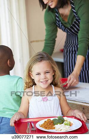 Elementary Pupil Collecting Healthy Lunch In Cafeteria View Large Photo Image Stock Image - Elementary Pupil Collecting Healthy Lunch In Cafeteria. Fotosearch