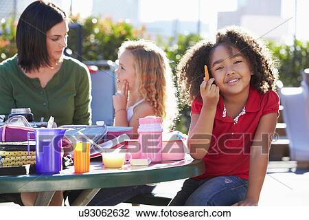 Elementary Pupils And Teacher Eating Lunch View Large Photo Image Stock Image - Elementary Pupils And Teacher Eating Lunch. Fotosearch