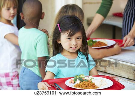 Stock Image - Elementary Pupils Collecting Healthy Lunch In Cafeteria. Fotosearch