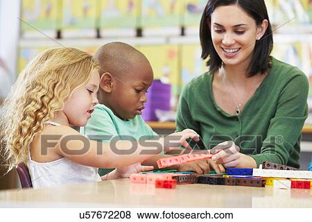Elementary Pupils Counting With Teacher In Classroom View Large Photo Image Stock Photo - Elementary Pupils Counting With Teacher In Classroom. Fotosearch