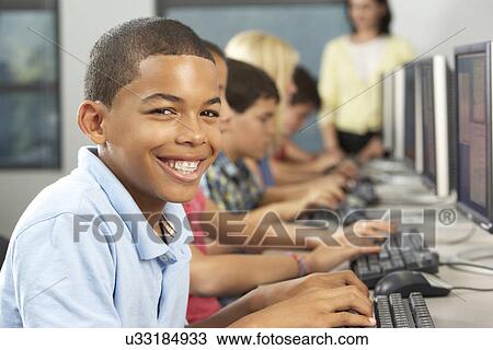 Elementary Students Working At Computers In Classroom View Large Photo Image Stock Image - Elementary Students Working At Computers In Classroom. Fotosearch