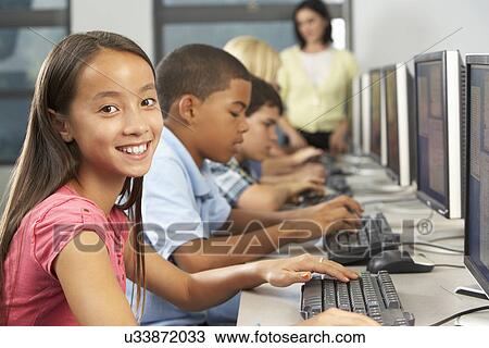 Elementary Students Working At Computers In Classroom View Large Photo Image Stock Image - Elementary Students Working At Computers In Classroom. Fotosearch