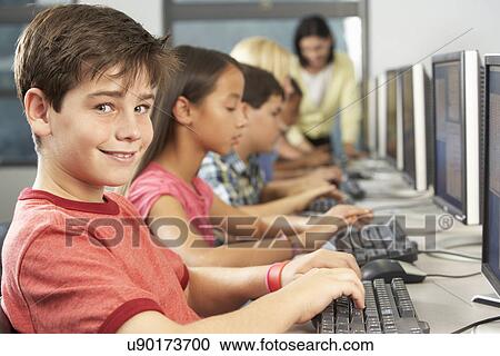 Elementary Students Working At Computers In Classroom View Large Photo Image Stock Image - Elementary Students Working At Computers In Classroom. Fotosearch