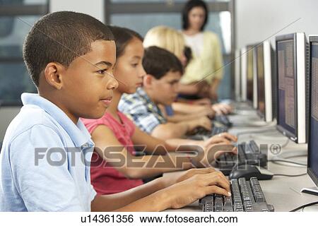 Elementary Students Working At Computers In Classroom View Large Photo Image Stock Photograph - Elementary Students Working At Computers In Classroom. Fotosearch