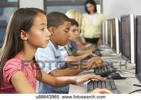 Elementary Students Working At Computers In Classroom View Large Photo Image Stock Photography - Elementary Students Working At Computers In Classroom. Fotosearch