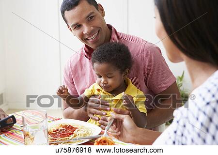 Family Eating Meal Together At Home View Large Photo Image Stock Photo - Family Eating Meal Together At Home. Fotosearch
