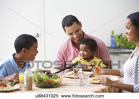 Family Eating Meal Together At Home View Large Photo Image Stock Photography - Family Eating Meal Together At Home. Fotosearch