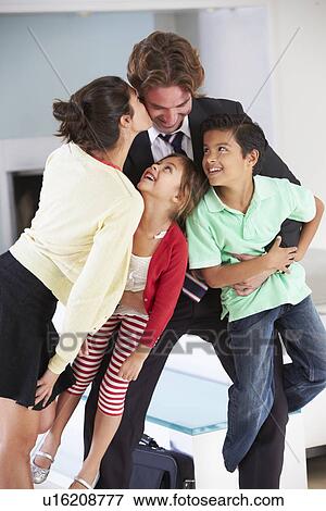 Family Greeting Father On Return From Work View Large Photo Image Stock Photo - Family Greeting Father On Return From Work. Fotosearch