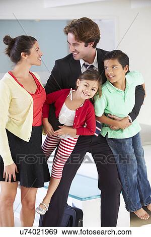 Family Greeting Father On Return From Work View Large Photo Image Stock Photo - Family Greeting Father On Return From Work. Fotosearch