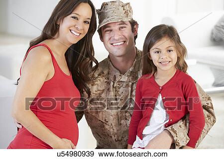 Stock Photo - Family Greeting Military Father Home On Leave. Fotosearch