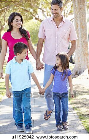 Family Walking Along Suburban Street View Large Photo Image Stock Image - Family Walking Along Suburban Street. Fotosearch