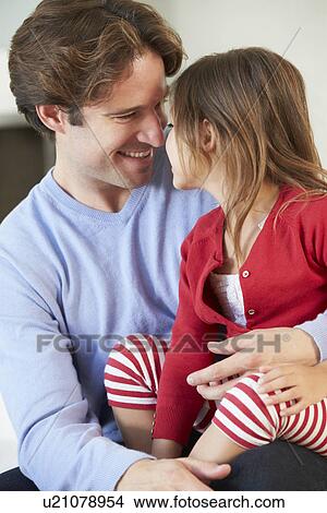 Father And Daughter Relaxing On Sofa Together View Large Photo Image Picture - Father And Daughter Relaxing On Sofa Together. Fotosearch