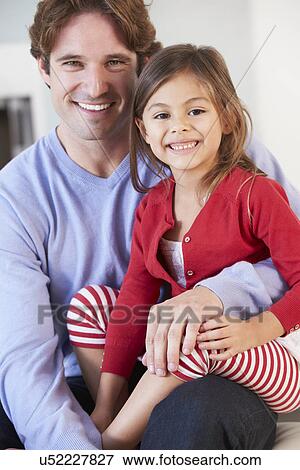 Father And Daughter Relaxing On Sofa Together View Large Photo Image Stock Photo - Father And Daughter Relaxing On Sofa Together. Fotosearch