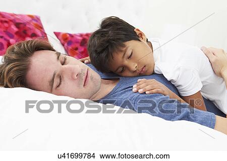 Father And Son Lying In Bed Together View Large Photo Image Picture - Father And Son Lying In Bed Together. Fotosearch