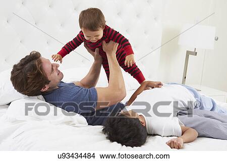 Father Playing In Bed With Children View Large Photo Image Picture - Father Playing In Bed With Children. Fotosearch