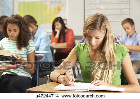 Female Pupil Studying At Desk In Classroom View Large Photo Image Picture - Female Pupil Studying At Desk In Classroom. Fotosearch