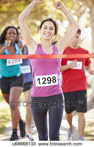Female Runner Winning Marathon View Large Photo Image Stock Image - Female Runner Winning Marathon. Fotosearch
