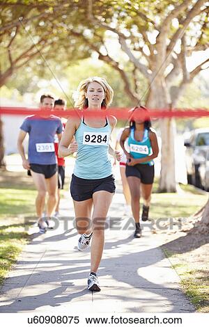 Female Runner Winning Marathon View Large Photo Image Stock Photography - Female Runner Winning Marathon. Fotosearch