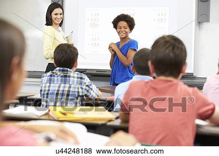 Female Student Writing Answer On Whiteboard View Large Photo Image Stock Photo - Female Student Writing Answer On Whiteboard. Fotosearch