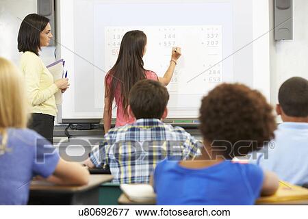 Female Student Writing Answer On Whiteboard View Large Photo Image Stock Photo - Female Student Writing Answer On Whiteboard. Fotosearch