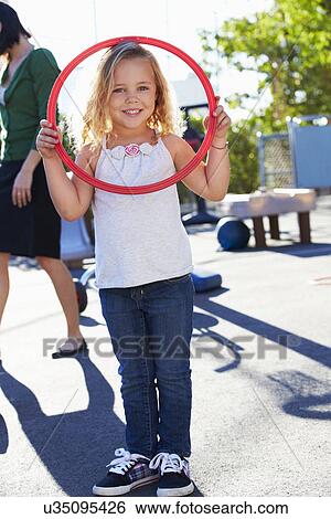 Girl In School Playground With Hoop View Large Photo Image Stock Photograph - Girl In School Playground With Hoop. Fotosearch
