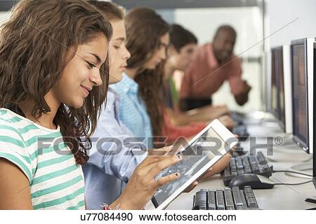 Girl Using Digital Tablet In Computer Class View Large Photo Image Stock Image - Girl Using Digital Tablet In Computer Class. Fotosearch