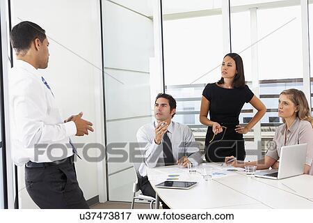 Group Of Businesspeople Meeting In Office View Large Photo Image Stock Photo - Group Of Businesspeople Meeting In Office. Fotosearch