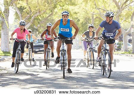 Group Of Cyclists On Suburban Street View Large Photo Image Stock Image - Group Of Cyclists On Suburban Street. Fotosearch