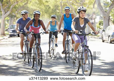 Stock Photo - Group Of Cyclists On Suburban Street. Fotosearch