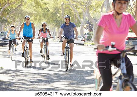 Group Of Cyclists On Suburban Street View Large Photo Image Stock Photo - Group Of Cyclists On Suburban Street. Fotosearch