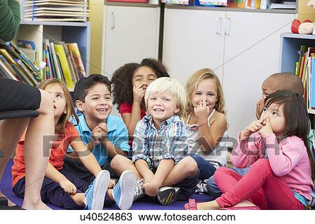 Group of Elementary Pupils In Classroom Touching Noses View Large Photo Image Stock Image - Group of Elementary Pupils In Classroom Touching Noses. Fotosearch