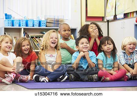 Stock Photograph - Group of Elementary Pupils In Classroom. Fotosearch
