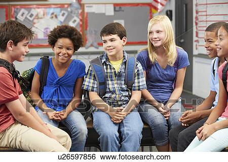Stock Photograph - Group of Elementary Pupils In Classroom . Fotosearch