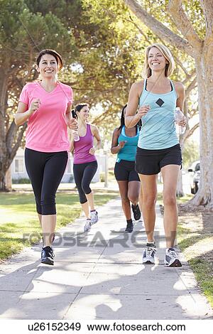 Group Of Female Runners Exercising On Suburban Street View Large Photo Image Stock Photo - Group Of Female Runners Exercising On Suburban Street. Fotosearch