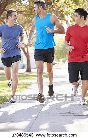 Group Of Male Runners Exercising On Suburban Street View Large Photo Image Stock Image - Group Of Male Runners Exercising On Suburban Street. Fotosearch
