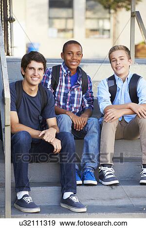 Stock Photo - Group Of Male Teenage Pupils Outside Classroom. Fotosearch