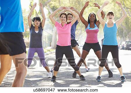 Group Of People Exercising Street With Personal Trainer View Large Photo Image Stock Photo - Group Of People Exercising Street With Personal Trainer. Fotosearch