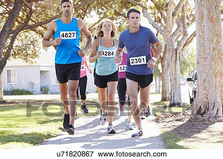 Stock Photo - Group Of Runners On Suburban Street. Fotosearch