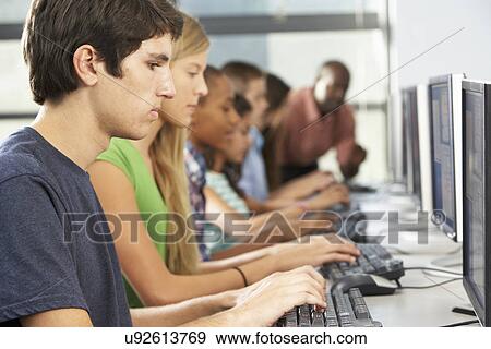 Group Of Students Working At Computers In Classroom View Large Photo Image Stock Photo - Group Of Students Working At Computers In Classroom. Fotosearch
