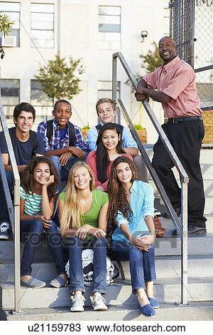 Group Of Teenage Pupils Outside Classroom With Teacher View Large Photo Image Stock Image - Group Of Teenage Pupils Outside Classroom With Teacher. Fotosearch
